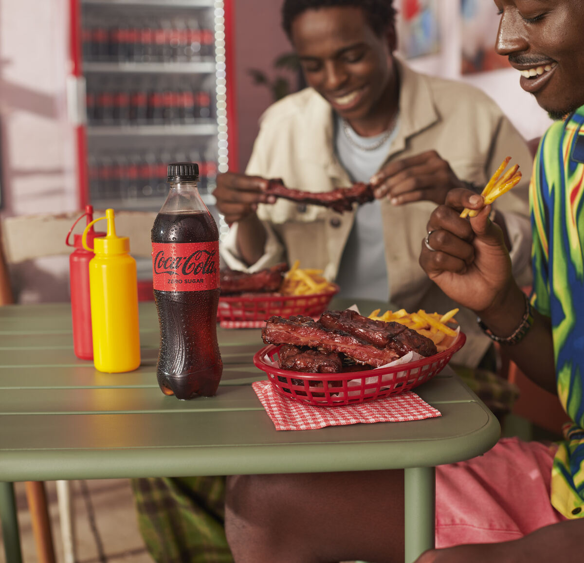 Sharing sticky ribs and chips with an ice-cold Coca-Cola