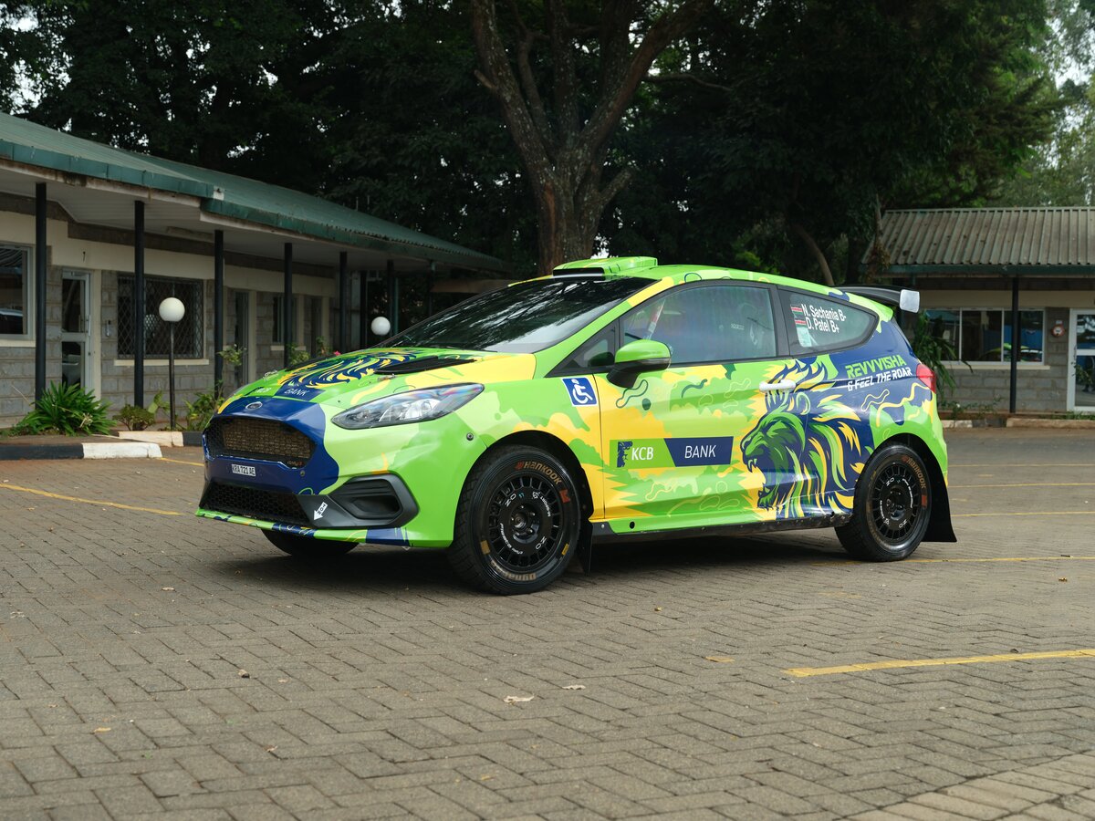 Original on-location photo of the KCB Bank liveried rally car before compositing