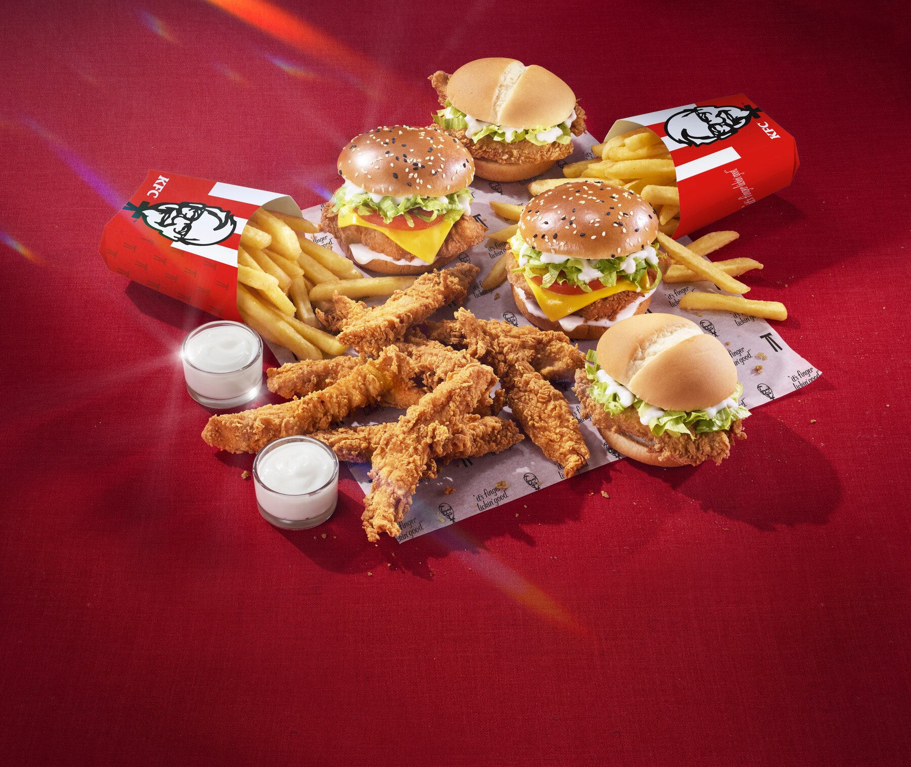 The Ultimate Burger Deal — stacked chicken burgers, tenders and fries campaign shot