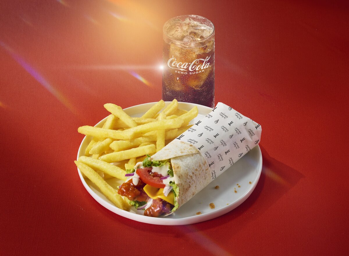 Buffalo Ranch Twister wrap plated with fries and Coca-Cola