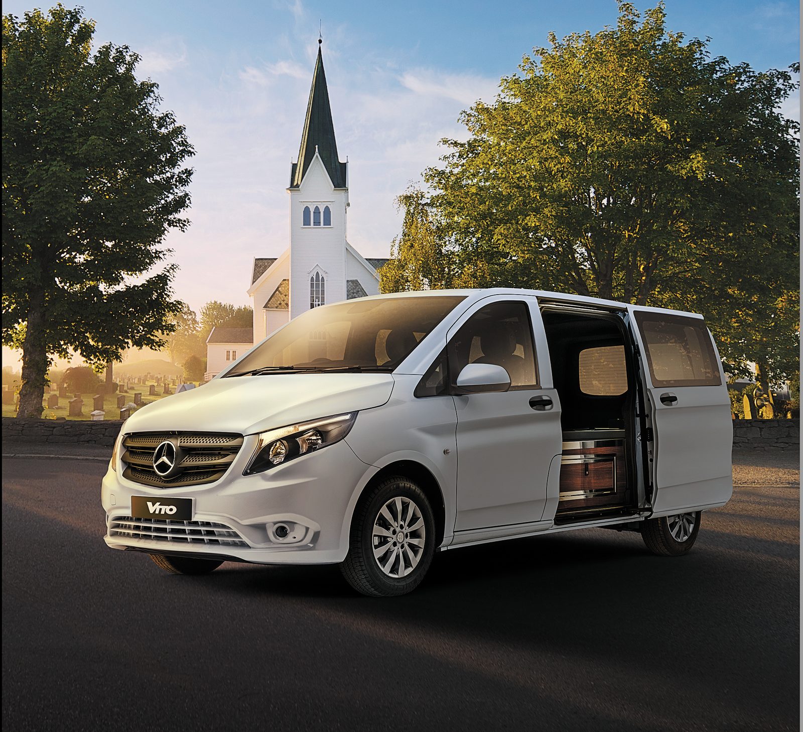 Mercedes-Benz Vito composite parked in front of a country church at golden hour