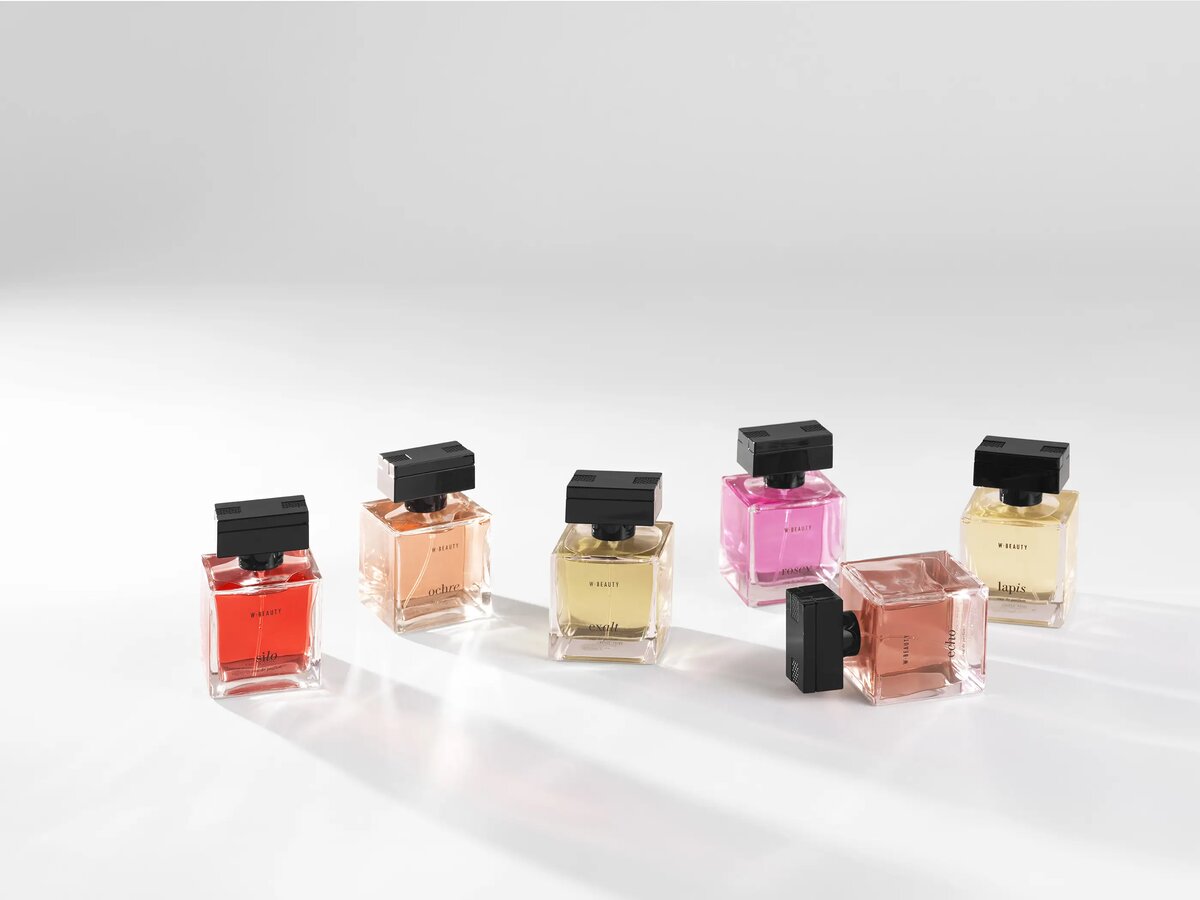 Lineup of seven W Beauty own-brand fragrance bottles